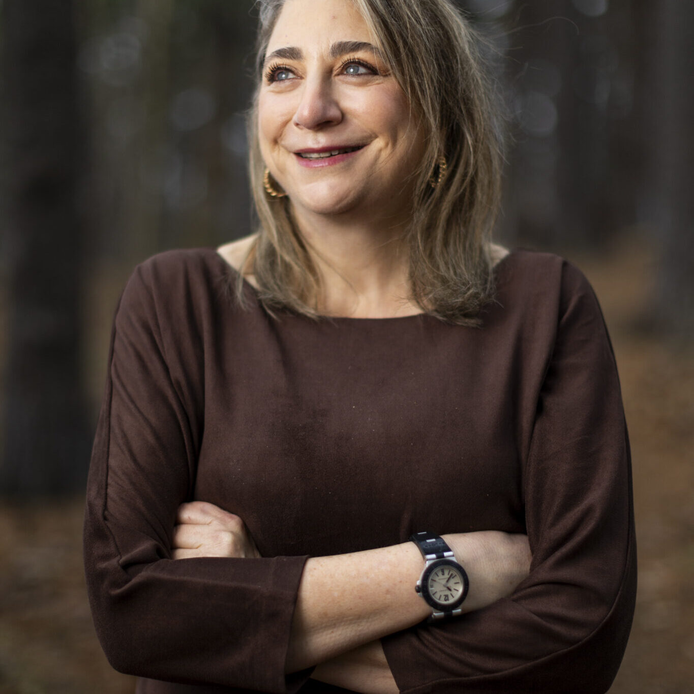 Ann_Davlin Ann Davlin poses for a portrait by Fresh Pond in Cambridge, MA on March 15, 2024. Photo by Adam Glanzman for NMH